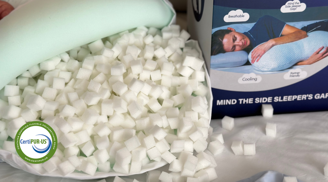 the clutcher pillow opened showing the customizable cubes filling with the packaging box on the side 