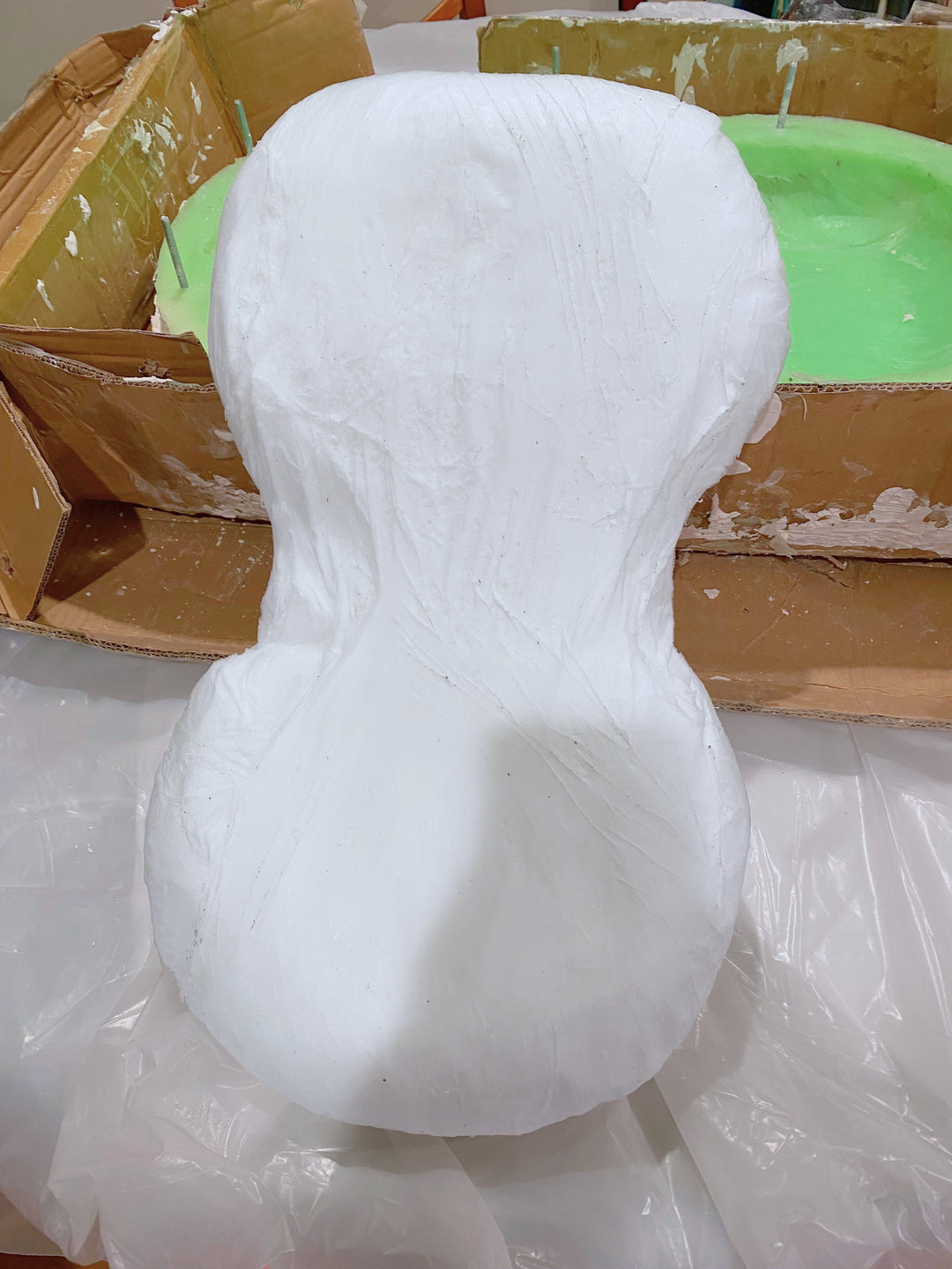 Early prototype of the Clutcher Therapeutic Pillow showing its ergonomic side-sleeper design